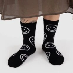 Black Happy Face Crew Socks 5 Black Happy Face Crew Socks -Baggu Lifestyle Cheap Store person wearing black happy face crew socks